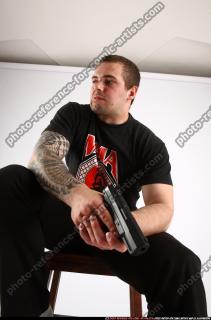 2013 09 ALEX SITTING PISTOL POSE1 09