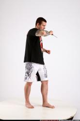 Man Adult Athletic White Fighting with knife Standing poses Sportswear