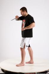 Man Adult Athletic White Fighting with knife Standing poses Sportswear