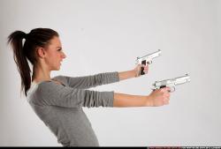 Peggy-double-guns-pose1