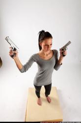 Woman Adult Athletic White Fighting with gun Standing poses Casual