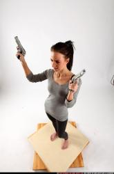 Peggy-double-guns-pose2