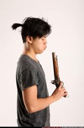 Man Young Athletic Fighting with gun Detailed photos Casual Asian