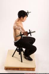 Man Young Athletic Fitness poses Sitting poses Pants Asian