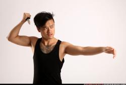 Man Young Athletic Fighting with knife Standing poses Casual Asian