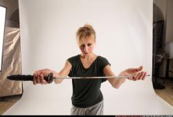 Woman Adult Athletic White Fighting with sword Standing poses Casual