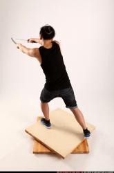 Man Young Athletic Fighting with sword Standing poses Casual Asian