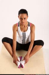 Woman Young Athletic Fitness poses Sitting poses Sportswear Latino