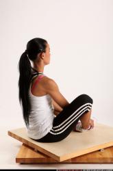 Woman Young Athletic Fitness poses Sitting poses Sportswear Latino