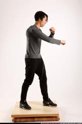 Man Young Athletic Fighting with knife Standing poses Casual Asian