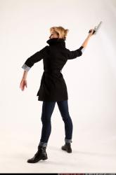 Woman Adult Athletic White Fighting with gun Standing poses Coat