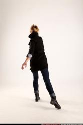 Woman Adult Athletic White Fighting with gun Standing poses Coat