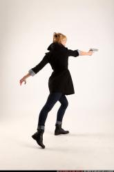 Woman Adult Athletic White Fighting with gun Standing poses Coat