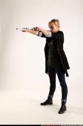 Woman Adult Athletic White Fighting with gun Standing poses Coat