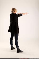 Woman Adult Athletic White Fighting with gun Standing poses Coat