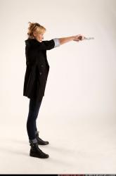 Woman Adult Athletic White Fighting with gun Standing poses Coat