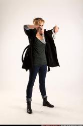 Woman Adult Athletic White Fighting with gun Standing poses Coat