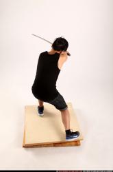 Man Young Athletic Fighting with sword Kneeling poses Sportswear Asian