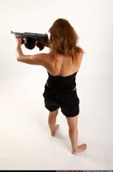 Woman Adult Athletic White Fighting with submachine gun Standing poses Casual