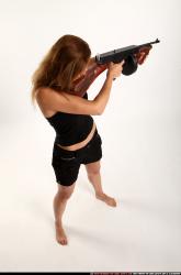 Woman Adult Athletic White Fighting with submachine gun Standing poses Casual