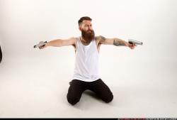 Man Adult Athletic White Fighting with gun Kneeling poses Casual