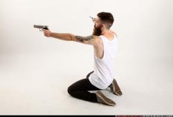 Man Adult Athletic White Fighting with gun Kneeling poses Casual