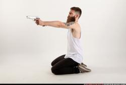 Man Adult Athletic White Fighting with gun Kneeling poses Casual