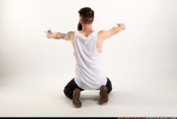 Man Adult Athletic White Fighting with gun Kneeling poses Casual