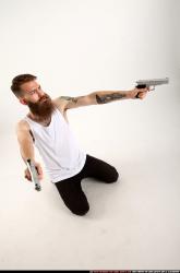 Man Adult Athletic White Fighting with gun Kneeling poses Casual