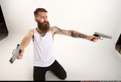 Man Adult Athletic White Fighting with gun Kneeling poses Casual