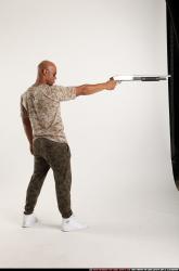 Man Adult Athletic Black Standing poses Army Fighting with shotgun