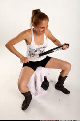 Woman Adult Athletic White Sitting poses Casual Fighting with bat