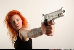 Woman Adult Athletic White Fighting with gun Standing poses Casual