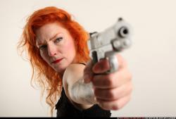 Woman Adult Athletic White Fighting with gun Standing poses Casual