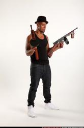 Ron-tommyguns-pose1