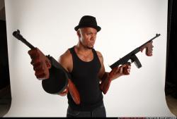 Ron-tommyguns-pose1