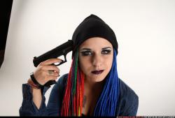 Woman Young Average White Fighting with gun Sitting poses Casual