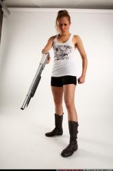 Woman Adult Athletic White Sitting poses Casual Fighting with shotgun