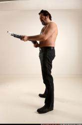 Man Old Average White Standing poses Pants Fighting with shotgun