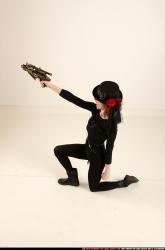 Woman Adult Athletic White Fighting with gun Kneeling poses Casual