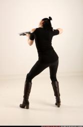 Woman Adult Athletic White Fighting with gun Standing poses Casual