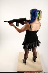 Woman Young Average White Fighting with submachine gun Standing poses Casual