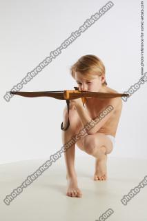 kneeling young boy with crossbow novel 01