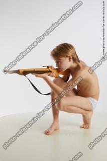 kneeling young boy with crossbow novel 02