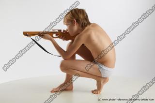 kneeling young boy with crossbow novel 03