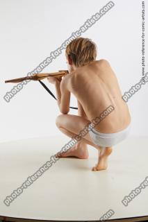 kneeling young boy with crossbow novel 04