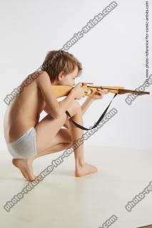 kneeling young boy with crossbow novel 06