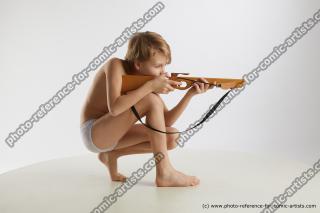kneeling young boy with crossbow novel 07